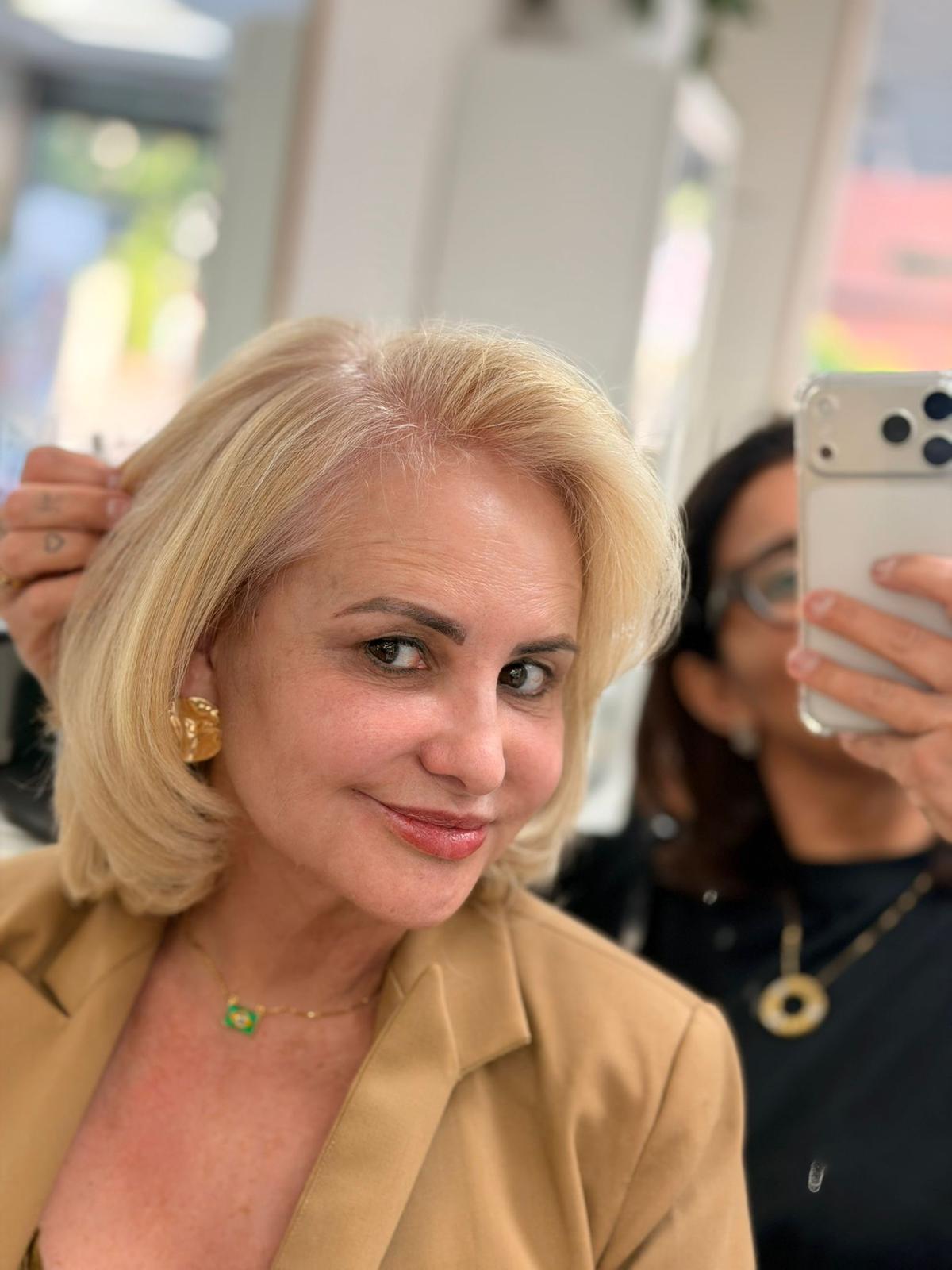 Polished blonde bob with soft natural makeup