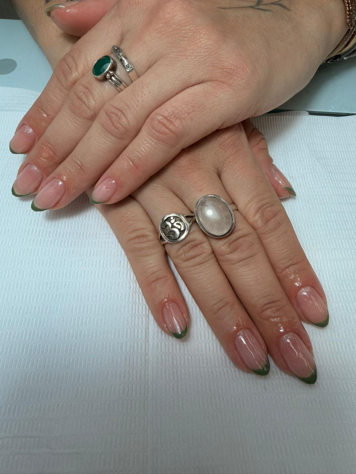 Almond nails with sage green French tips